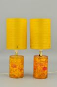 A PAIR OF SHATTALINE TABLE LAMPS, amber coloured with cylindrical fibre glass shades, height 36cm