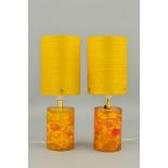 A PAIR OF SHATTALINE TABLE LAMPS, amber coloured with cylindrical fibre glass shades, height 36cm