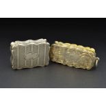 TWO VICTORIAN SILVER VINAIGRETTES, of wavy rectangular form, one engraved with foliate scrolls and