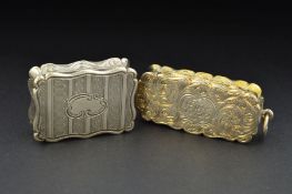 TWO VICTORIAN SILVER VINAIGRETTES, of wavy rectangular form, one engraved with foliate scrolls and
