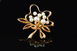 A MID TO LATE 20TH CENTURY MIKIMOTO CULTURED PEARL BROOCH, foliate scroll form, measuring 3.95mm
