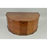 AN EARLY 19TH CENTURY MAHOGANY BOX OF PANELLED SEMI CIRCULAR FORM, the hinged top over nine
