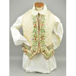 AN 18TH CENTURY IVORY SILK AND FLORAL EMBROIDERED GENTLEMAN'S WAISTCOAT, pockets with faux flaps,