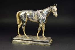 A WMF SILVER PLATED MODEL OF A HORSE, cast as standing on foliage, lacks some parts of tack, the