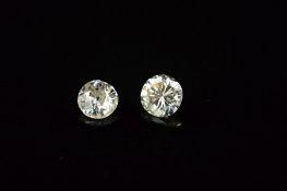 TWO ROUND BRILLIANT CUT DIAMONDS, first 0.29ct, colour assessed as J-K, clarity SI2-I1, second Old