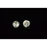 TWO ROUND BRILLIANT CUT DIAMONDS, first 0.29ct, colour assessed as J-K, clarity SI2-I1, second Old