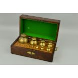 A GRADUATED SET OF THIRTEEN GEORGE IV BRASS SPHERICAL WEIGHTS, by Bate of London, dated 1824, the