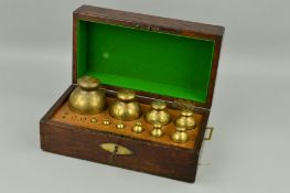 A GRADUATED SET OF THIRTEEN GEORGE IV BRASS SPHERICAL WEIGHTS, by Bate of London, dated 1824, the