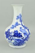 A CHINESE PORCELAIN BLUE AND WHITE BALUSTER VASE, decorated with an eagle perched in the branch of a