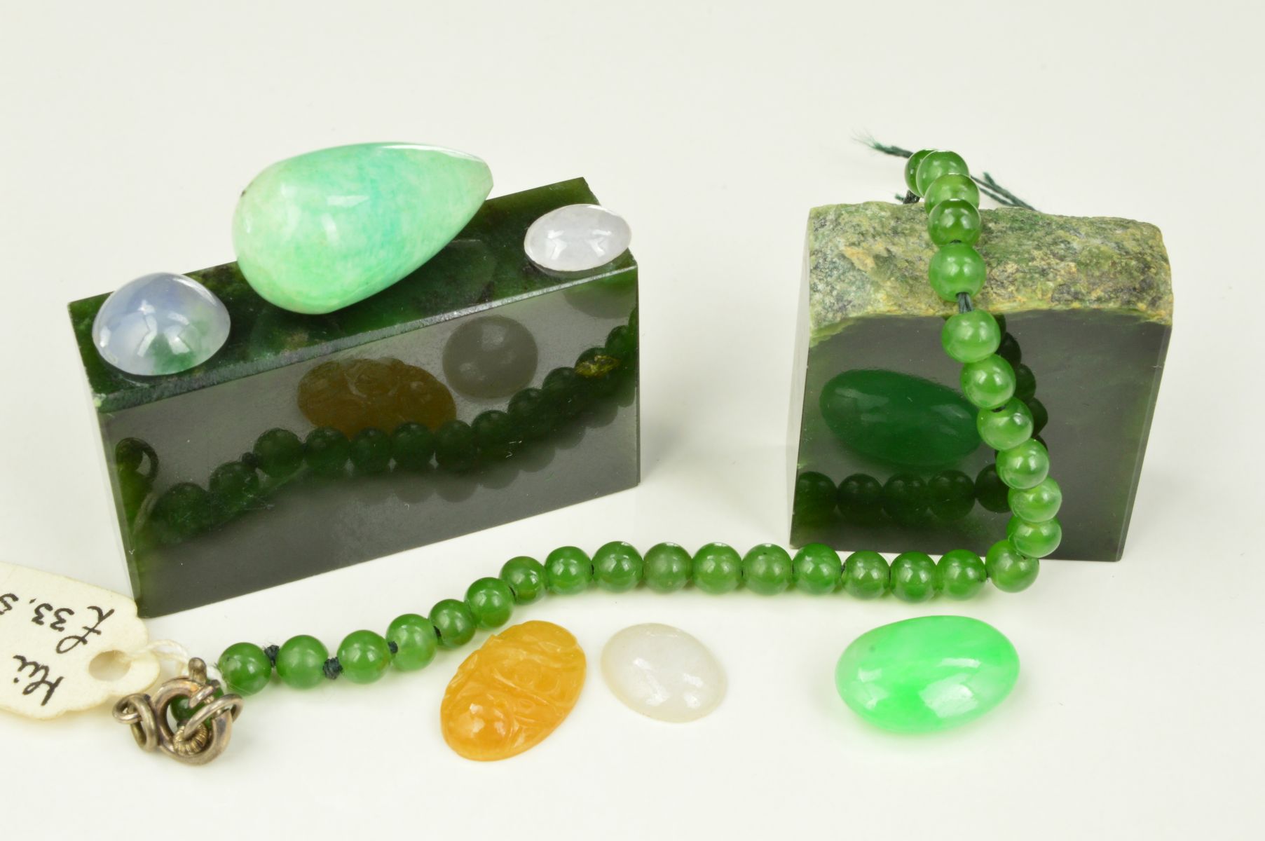 A COLLECTION OF JADEITE AND NEPHRITE JADE, mixed colours to include pale green, brownish yellow,