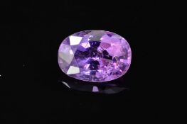 A MAUVE/LAVENDER COLOURED OVAL MIXED CUT SAPPHIRE, measuring approximately 11.5mm x 8mm, weighing