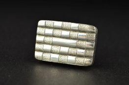 A GEORGE III SILVER VINAIGRETTE, of rectangular form, ribbed and engraved exterior, blind