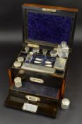 A VICTORIAN BURR WALNUT DRESSING CASE, the hinged cover with brass rectangular cartouche with