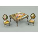 A LATE 19TH/EARLY 20TH CENTURY MINIATURE ENAMEL TABLE AND TWO CHAIRS, cast metal frames, the