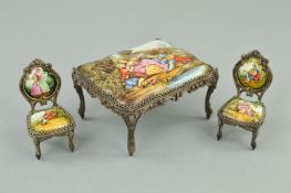 A LATE 19TH/EARLY 20TH CENTURY MINIATURE ENAMEL TABLE AND TWO CHAIRS, cast metal frames, the