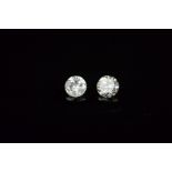 TWO MODERN ROUND BRILLIANT CUT DIAMONDS, first 0.30ct, colour assessed as G-H, clarity I1-1,