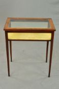 AN EDWARDIAN MAHOGANY AND EBONY BANDED TABLE DISPLAY CABINET, of rectangular form, hinged top,