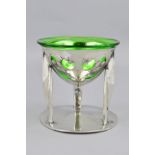 ARCHIBALD KNOX FOR LIBERTY & CO, a Tudric pewter and green glass coupe, the bowl pierced and cast