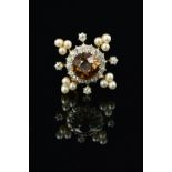 A DIAMOND, BROWN ZIRCON AND CULTURED PEARL SMALL BROOCH, centring on a round mixed cut brown zircon,