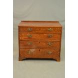 A GEORGE III OAK CHEST OF FOUR LONG GRADUATED DRAWERS, later short back, replacement brass swan neck