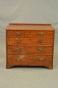 A GEORGE III OAK CHEST OF FOUR LONG GRADUATED DRAWERS, later short back, replacement brass swan neck