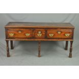 A GEORGE III OAK DRESSER BASE, with two long and one short drawer with brass swan neck handles and