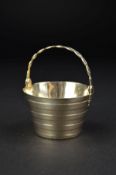 A GEORGE II SILVER CREAM PAIL, of coopered bucket form, oval lattice work swing handle, worn