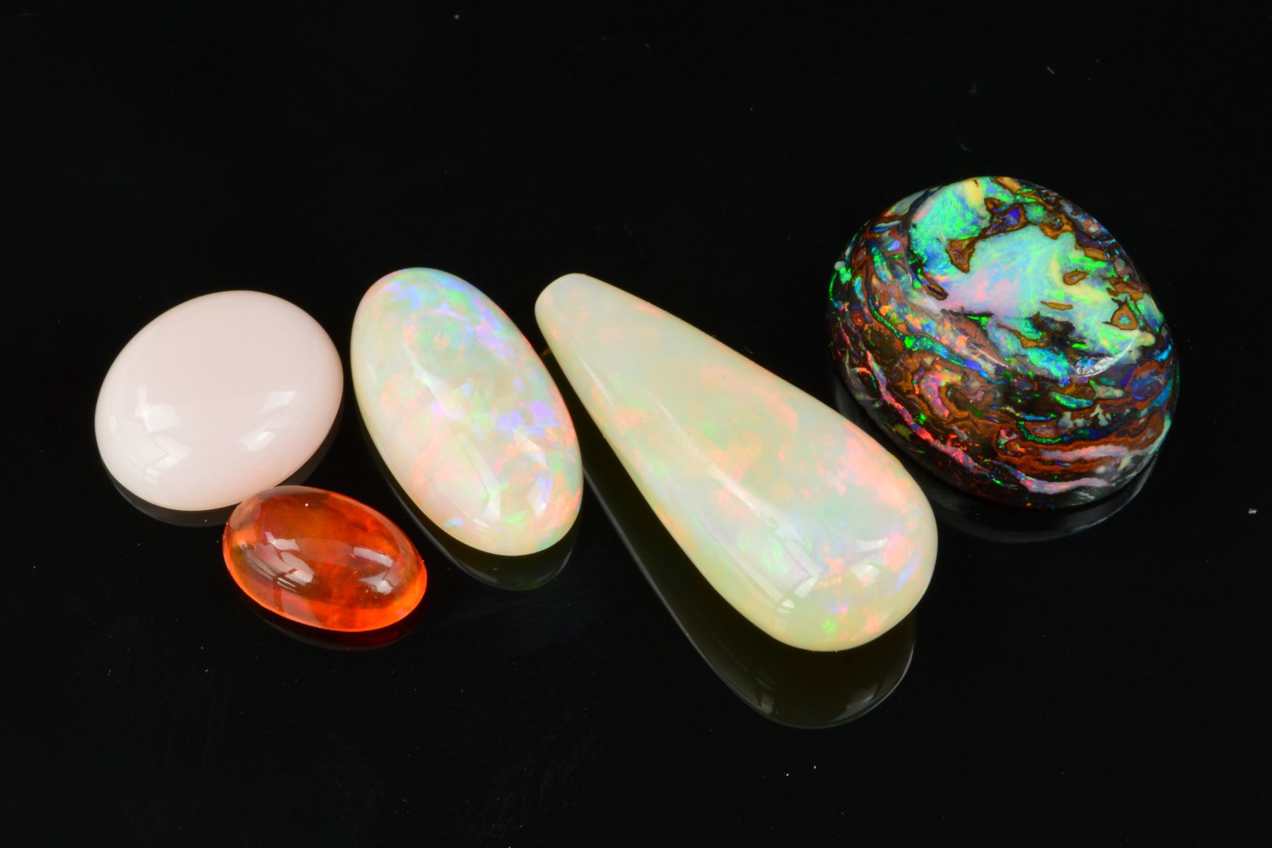 MIXED OPAL COLLECTION, to include a Mexican fire opal measuring 9.6mm x 6.2mm, weighing 1.20ct, a