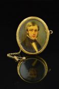 A LATE 19TH CENTURY GOLD PORTRAIT MINIATURE, of an unknown gentleman in classical attire, oval shape