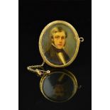 A LATE 19TH CENTURY GOLD PORTRAIT MINIATURE, of an unknown gentleman in classical attire, oval shape