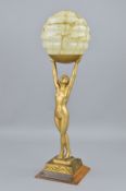 AN ART DECO NUDE FIGURAL LAMP, the female figure is holding aloft a smoke glass pattern shade,