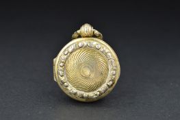 A GEORGE IV SILVER GILT WATCH CASE VINAIGRETTE, engine turned decoration with foliate border in