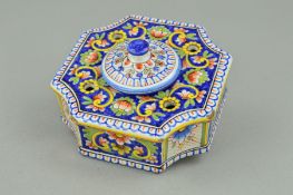AN EARLY 20TH CENTURY CONTINENTAL FAIENCE INKSTAND, of shaped square form, concave corners, with