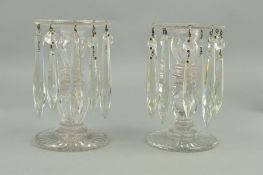 A PAIR OF VICTORIAN CLEAR GLASS LUSTRES, ribbed circular rims suspending ten droppers, on faceted
