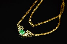 AN EMERALD AND DIAMOND CENTRE PIECE NECKLET, centring on an emerald cut emerald, estimated weight