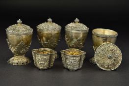 A PAIR OF CHINESE EXPORT WHITE METAL SALTS, of oval form, gilt lined, repousse decorated with panels