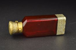 A VICTORIAN SAMPSON MORDAN & CO SILVER GILT AND RUBY GLASS COMBINATION PERFUME BOTTLE AND