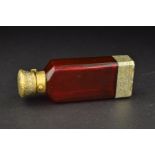 A VICTORIAN SAMPSON MORDAN & CO SILVER GILT AND RUBY GLASS COMBINATION PERFUME BOTTLE AND