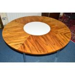 RICHARD YOUNG FOR MERROW ASSOCIATES, a rosewood and chrome circular dining table, model 342 R, the