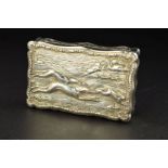 A VICTORIAN SILVER SNUFF BOX, of wavy rectangular outline, the raised relief hinged cover