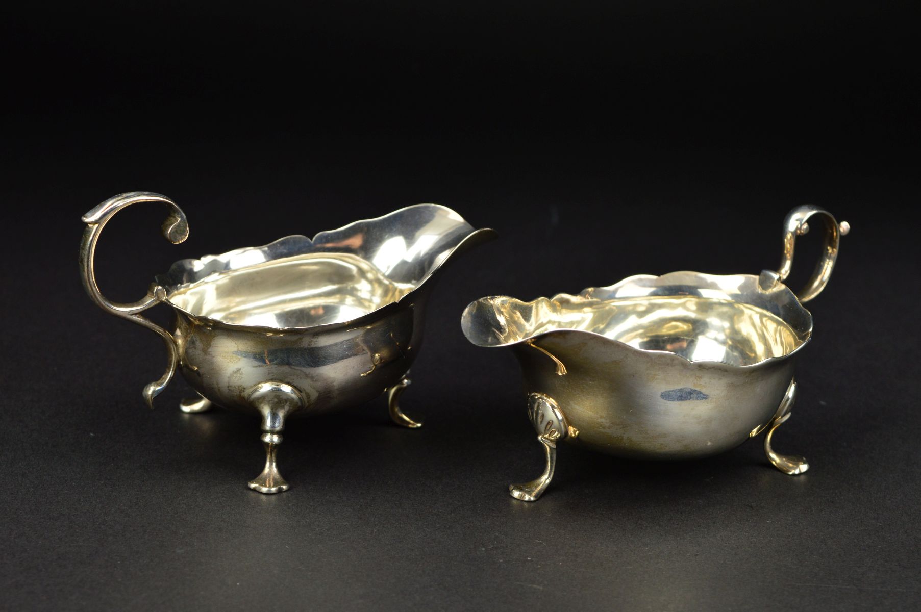 A GEORGE III NEWCASTLE SILVER SAUCEBOAT, wavy rim, 'S' scroll handle, on three cabriole legs with - Image 5 of 10