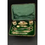 A LATE VICTORIAN/EDWARDIAN 9CT GOLD MOUNTED EIGHT PIECE LADIES MANICURE SET, comprising file,