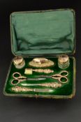 A LATE VICTORIAN/EDWARDIAN 9CT GOLD MOUNTED EIGHT PIECE LADIES MANICURE SET, comprising file,