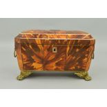AN EARLY 19TH CENTURY TORTOISESHELL TEA CADDY, of sarcophagus form, horn, ivory and pewter