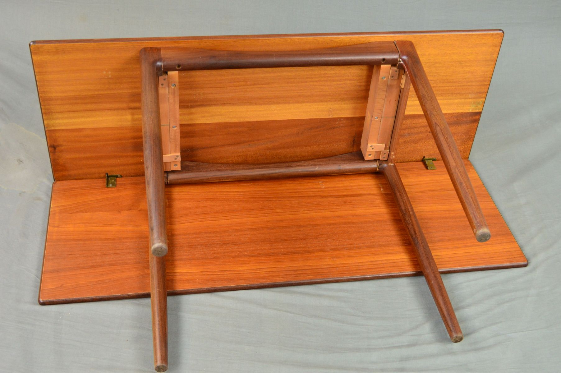 IB KOFOD LARSEN FOR G PLAN, a rectangular teak gate leg table on four cylindrical tapering legs, - Image 9 of 11