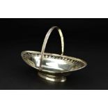 A GEORGE III SILVER SWING HANDLED SWEETMEAT BASKET, of navette form, foliate pierced and bright