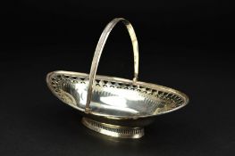 A GEORGE III SILVER SWING HANDLED SWEETMEAT BASKET, of navette form, foliate pierced and bright