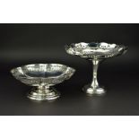 A GEORGE V SILVER PEDESTAL FRUIT BOWL, of wavy circular form, with pierced foliate scrolls, circular