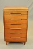 WHITE & NEWTON, PORTSMOUTH, a tall teak chest of seven long drawers with the top drawer reed