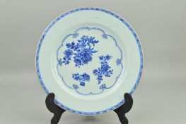 A CHINESE PORCELAIN PLATE, decorated with peony sprays in underglaze blue, lattice pattern border to